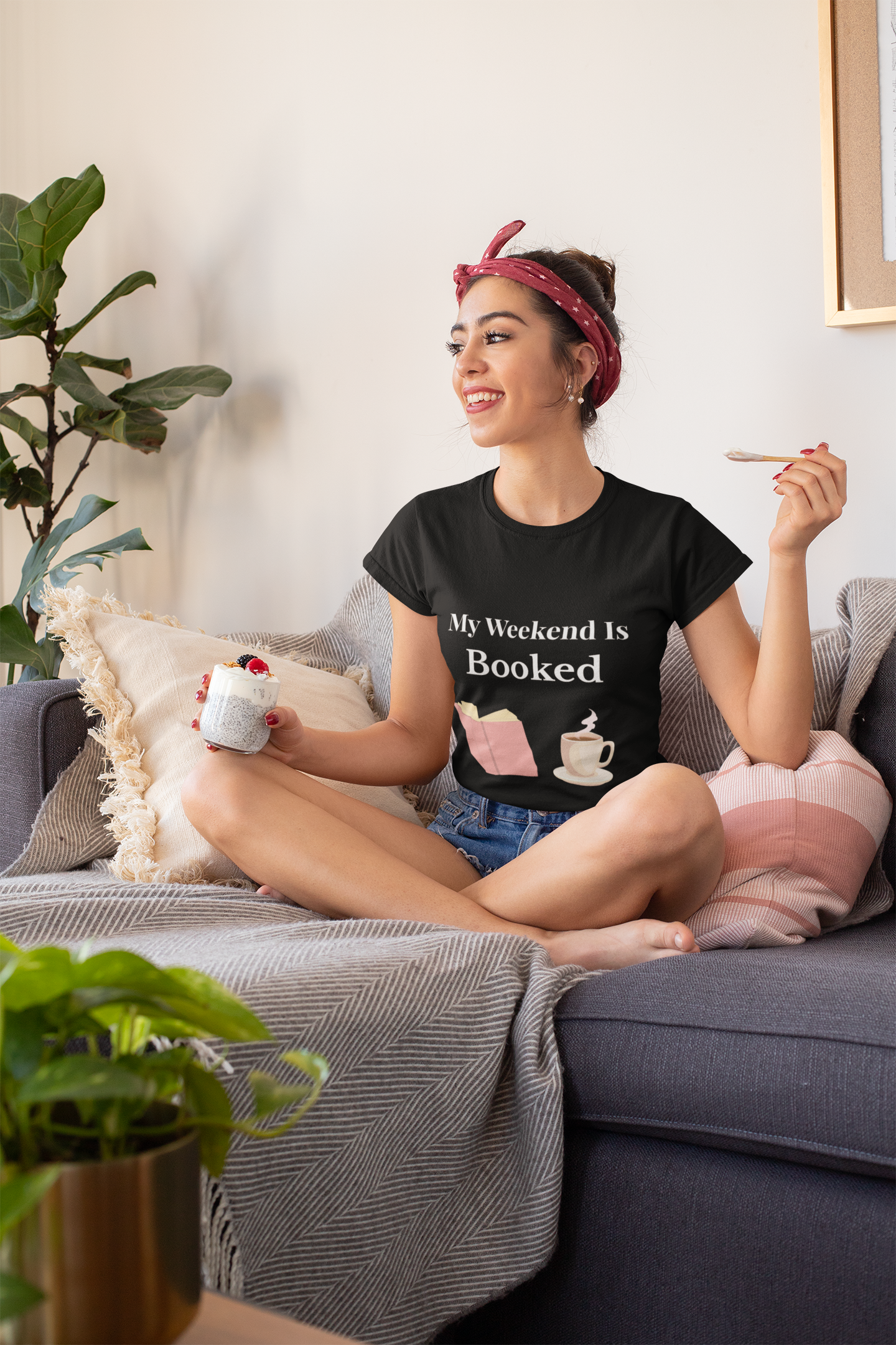Person wearing My Weekend Is Booked t-shirt – funny unisex book lover shirt for readers and introverts