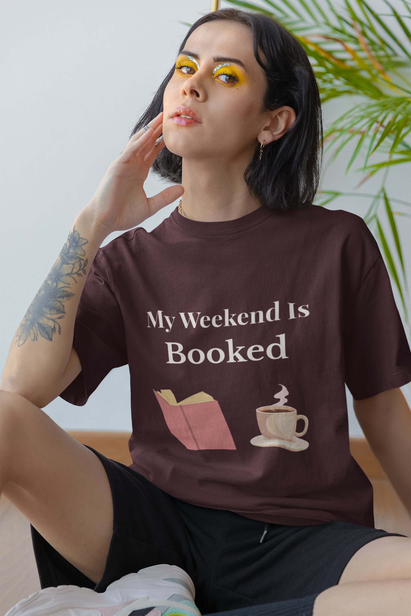 Person wearing My Weekend Is Booked t-shirt – funny unisex book lover shirt for readers and introverts